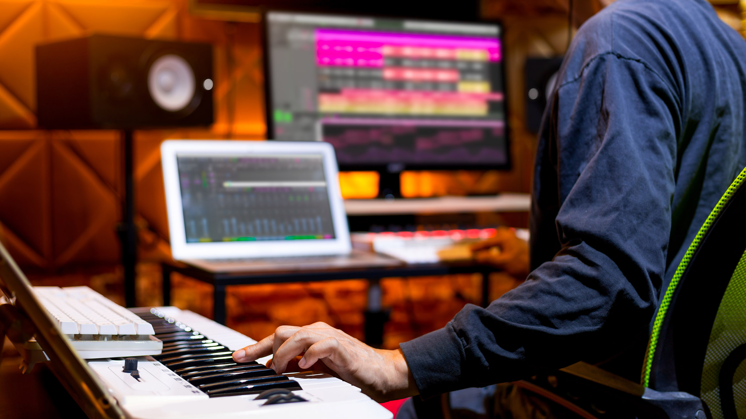 male producer, musician, composer making a song in home recording