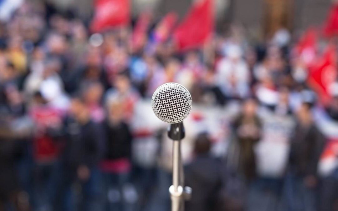 microphone in front of political crowd
