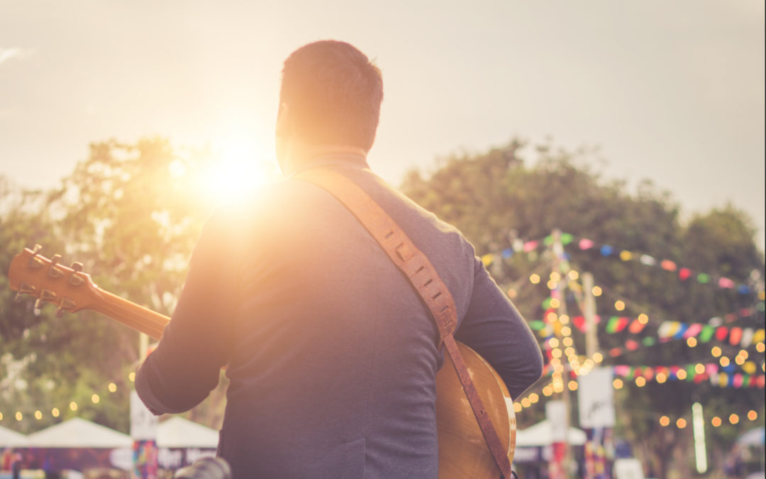 indie musician playing on stage